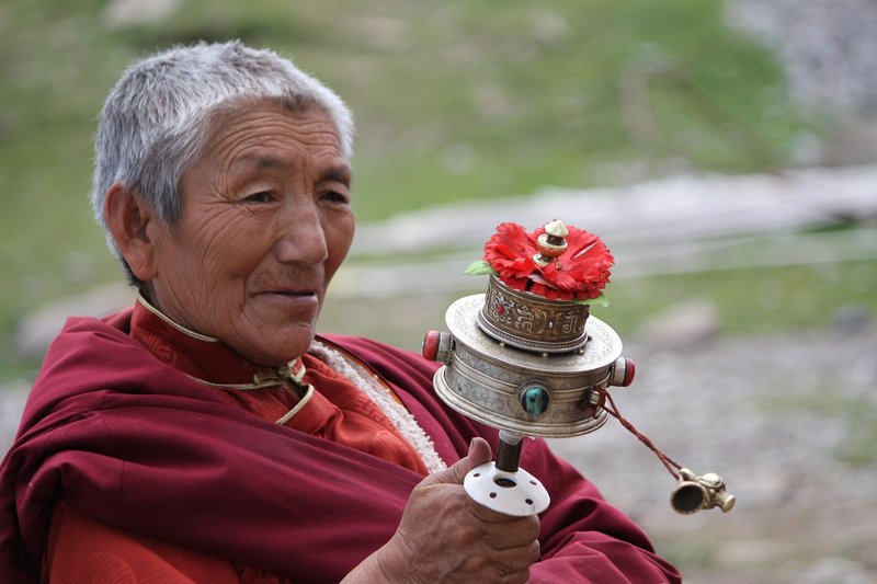 an-old-monk-praying-in-manaslu-region