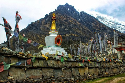"Mu Gompa Monastery perched on a hillside in Tsum Valley, showcasing traditional Tibetan architecture and spiritual heritage."